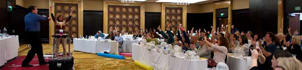 The audience cheers as Steve Spangler and a teacher perform a demonstration during a Hands-on Science Boot Camp Teacher Training event.