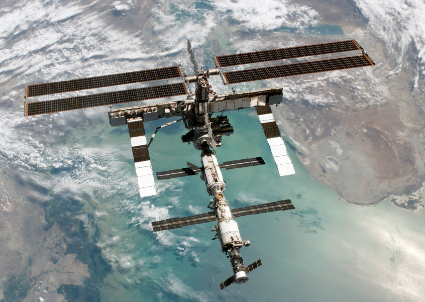 Backdropped against the Caspian Sea, this full view of the international space station was photographed by a crewmember onboard the Space Shuttle Discovery after the undocking of the two spacecraft. Image credit: NASA 