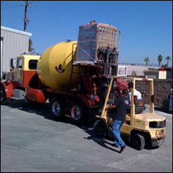 Lifting the cornstarch bags to the top of the cement mixer